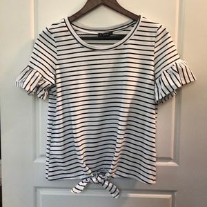 Striped top, tied accent with ruffled sleeves.